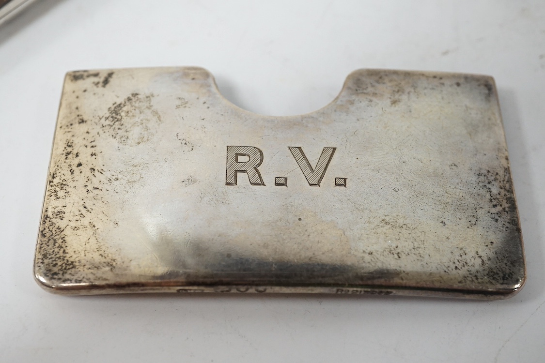 A late Victorian engraved silver card purse, by William Summers, London, 1880, 10cm, together with a similar wrythened silver card purse, Birmingham, 1892 and a small late Victorian silver card case. Condition - fair to